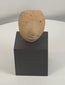 Rotating view of a Pre-Columbian terracotta human head fragment with stylized facial features, perforated eyes, pronounced nose, archaeological weathering, and custom display stand.