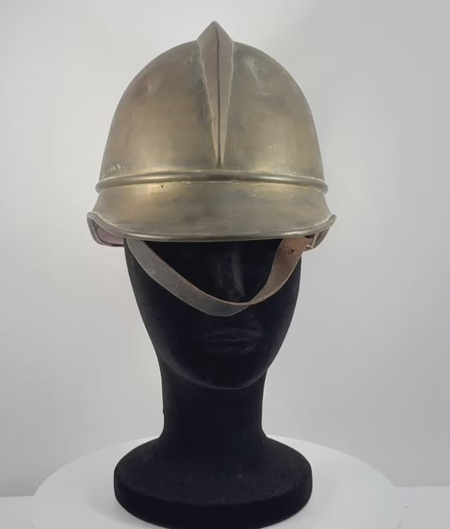 Rotating video of antique Bavarian German brass firefighter helmet with leather liner and chinstrap, circa 1908–1934