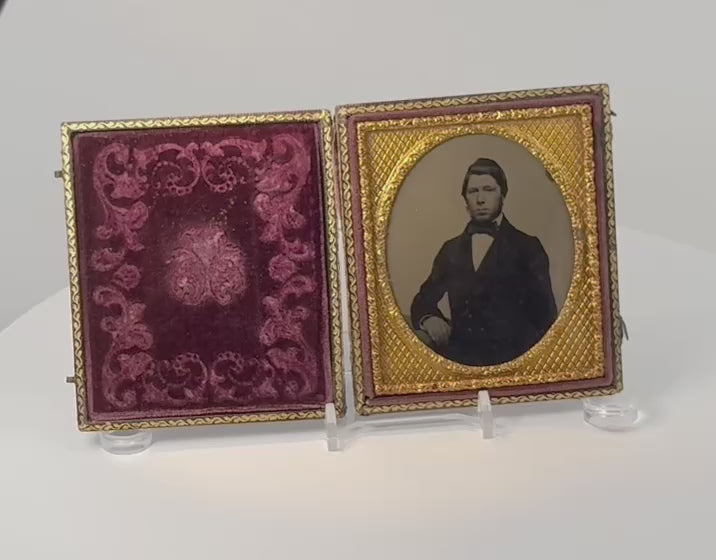 Video showcasing a mid-19th-century cased portrait of a Victorian gentleman with gilt-metal mat, burgundy velvet interior, and ornate embossed case