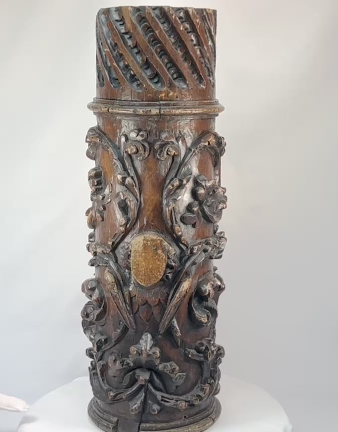 Antique Edo-period Japanese wooden temple pillar fragment, intricately hand-carved with swirling floral motifs and lattice detail, dark brown patina with areas of wear and age exposure, dating to the 18th century, originally part of a Buddhist architectural structure, showcasing traditional craftsmanship and religious artistry.