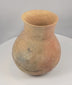 Rotating presentation of an ancient Pre-Columbian Central American earthenware vessel with a globular body, tall neck, flared rim, and visible restoration
