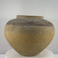 Antique Huastec terracotta water jar from Hidalgo, Mexico, dating to circa 1900–1920, featuring a traditional rounded olla form, gently flared neck, wide opening, hand-painted floral and flowing geometric motifs in dark mineral pigment, natural earthen patina, and traditional Mexican pottery craftsmanship.