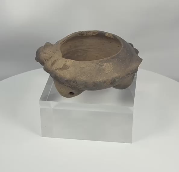 360-degree video of an authentic Pre-Columbian West Mexican terracotta tripod vessel showcasing its sculpted zoomorphic heads, hollow tripod legs, archaeological patina, and ceremonial craftsmanship dating to circa 300 BCE–300 CE.