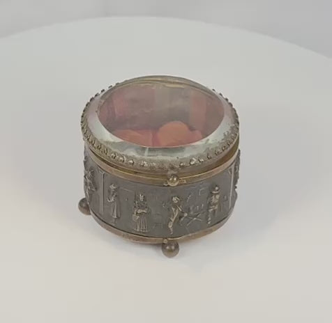 Video of an antique French jewelry casket with bas-relief figures, beveled glass lid, and period textile interior, circa 1870–1900