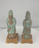 Rotating view of a pair of antique Chinese glazed pottery attendants with tall ceremonial caps, flowing robes, ritual objects, turquoise-blue and aubergine-brown glazes, and later wooden display bases