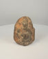 South Indian sandstone Ganesha votive sculpture showing worn devotional surface, pigment remnants and carved shrine-like form