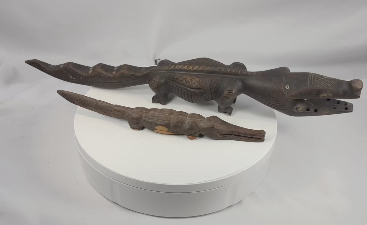 Video showing pair of Mali Bamana-Bozo attributed wooden crocodile carvings from multiple angles and close-up details
