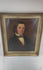 Video view of an early Victorian British oil portrait depicting an unidentified gentleman with dark arranged hair, prominent sideburns, a dark frock coat, burgundy waistcoat, cream shirt, high collar, and patterned silk cravat, shown in an antique giltwood frame with visible craquelure, surface wear, aged varnish, and the original canvas and wooden stretcher on the reverse