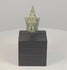 16th–17th century Southeast Asian bronze Buddha head with serene facial features, elongated earlobes, pointed ushnisha, natural green patina, and black display stand
