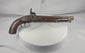 Rotating view of a mid-19th-century Afghan percussion holster pistol with a hardwood stock, engraved iron lock, brass muzzle mount, and original captive ramrod