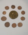 Video overview of a collection of 10 ancient Roman bronze coins, showing the large central imperial coin, smaller Late Roman issues, portraits, reverse designs, and varied archaeological patina.