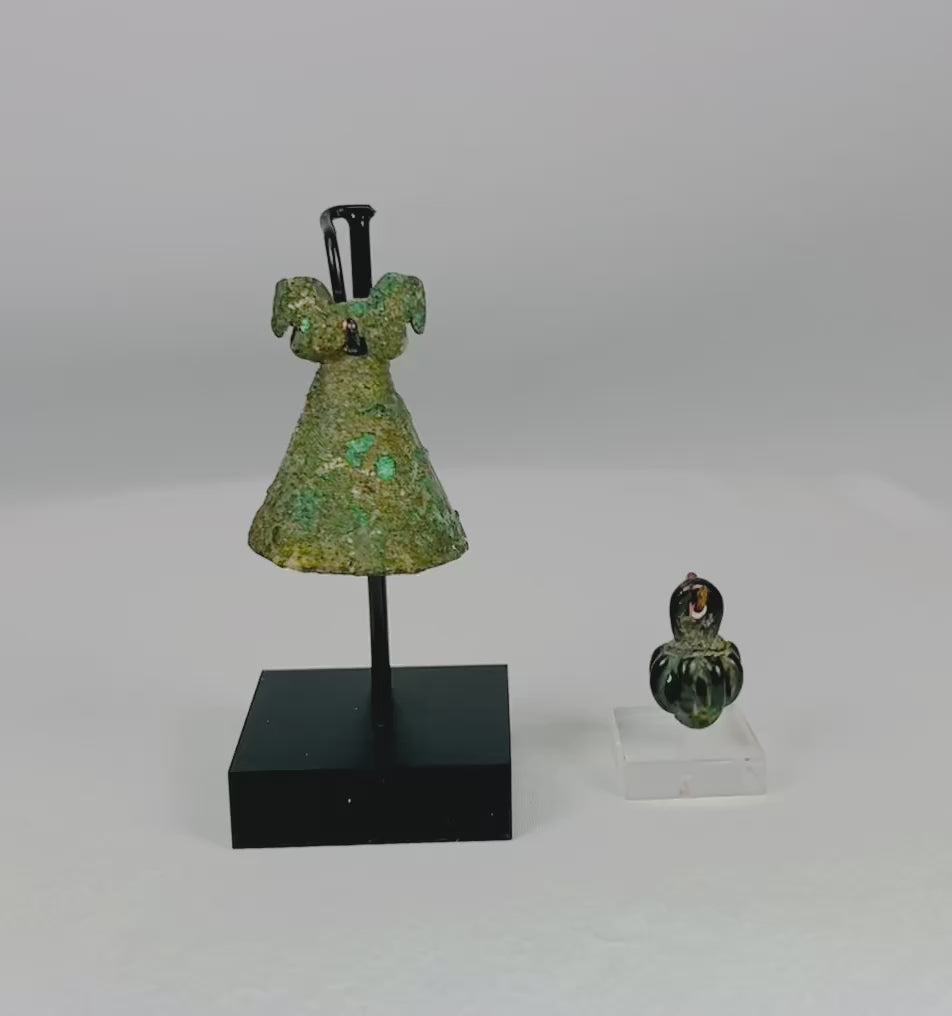 Ancient Luristan pendant bell from modern-day Lorestan, Iran, 1st Millennium BCE. Cast bronze/iron alloy openwork globe with seven bars and suspension loop, designed to contain rattle pellets. Iron Age ornament reflecting Luristan metalwork, ceremonial use, and symbolic protective function.