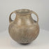 Rotating 360-degree video of an early Etruscan impasto spiral amphora, circa 700–650 BCE, showing its double handles, rounded body, incised spiral decoration, rim, base, and ancient surface patina.