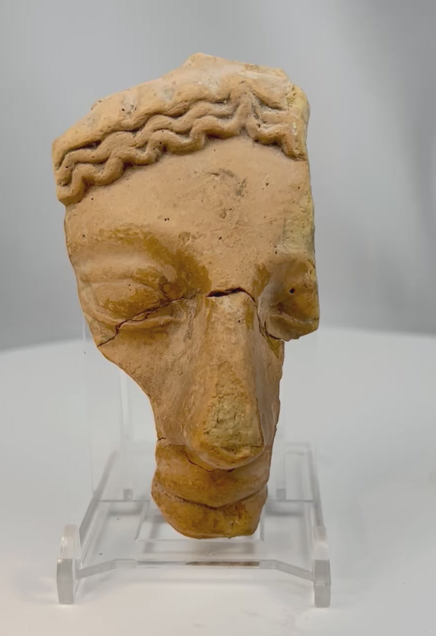 Ancient Greco-Roman terracotta theatrical mask fragment 360 view, classical theatre artifact mounted for display