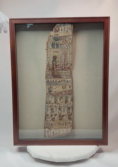 360-degree video of framed ancient Egyptian polychrome coffin fragment showing vivid painted scenes and scarab motif