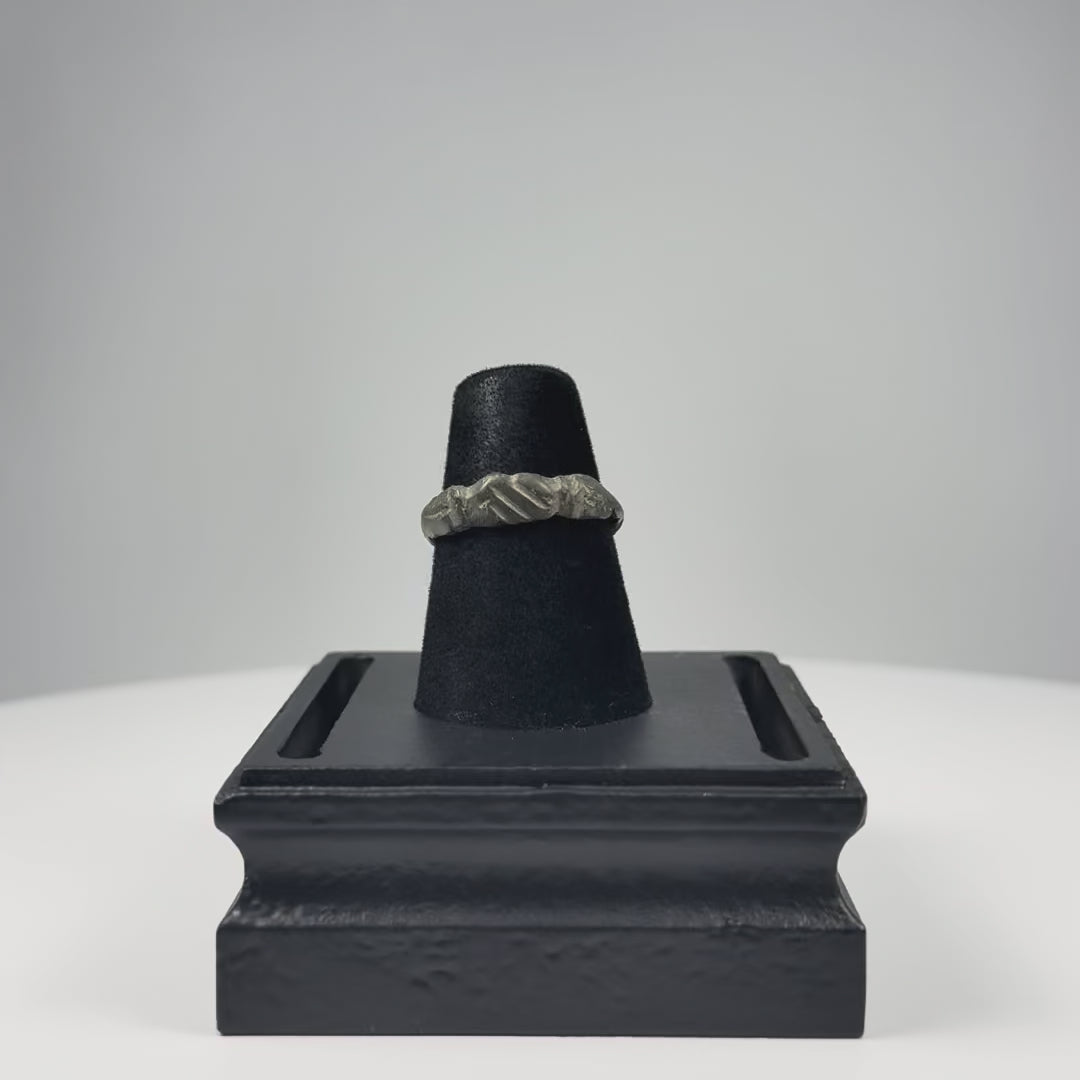 Video showing a Late Roman to Early Byzantine bronze finger ring with incised linear bezel, geometric shoulder decoration, complete hoop, and archaeological patina from multiple angles.