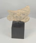 360-degree view of a Pre-Columbian terracotta figural fragment featuring a stylized human face, large earspools, and ceremonial headdress, Mesoamerica, circa 600–1200 CE.