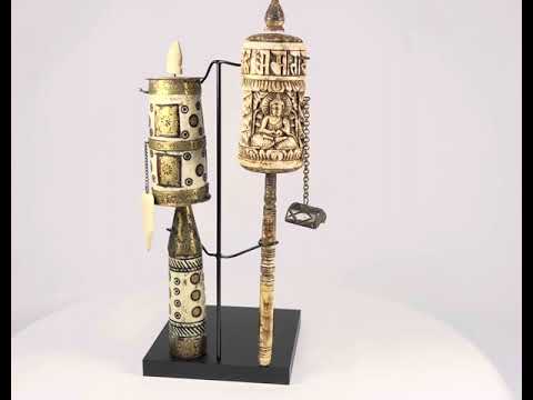Pair of Tibetan prayer wheels, late 19th century, hand-carved bone, brass, and wood with Buddha figure, mantra script, floral motifs, and custom stands.