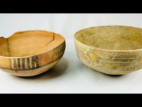 360-degree video of two Late Harappan Indus Valley terracotta bowls, rotating to show painted black motifs, buff slip, stabilized ancient cracks, and hand-formed surfaces from 1900–1300 BCE