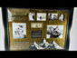 Video of framed display featuring Sir Edmund Hillary’s authentic hand-signed U.S. $1 banknote, professionally mounted with archival backing and protective glass. Includes historical photographs from the 1953 Everest expedition and a commemorative quote, “It is not the mountain we conquer but ourselves.” Certified by a forensic document examiner.