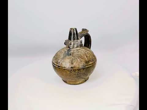 Small Sicán blackware ceramic bottle from Lambayeque Valley, Peru, 5.5 x 6 inches, burnished surface with elegant form, ritual and ceremonial artifact from 750–1375 A.D.