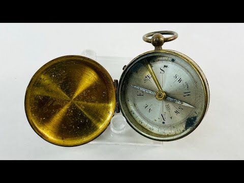 Rotating video of an antique French brass pocket compass (circa 1880–1920) with hinged lid, azimuth scale, and original glass face.