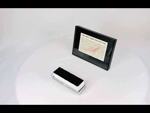 Authentic NASA Space Shuttle HRSI tile from the 1980s, silica-based ceramic with black Reaction Cured Glass (RCG) coating, designed for high-temperature reentry, displayed in original NASA-issued case with documentation.