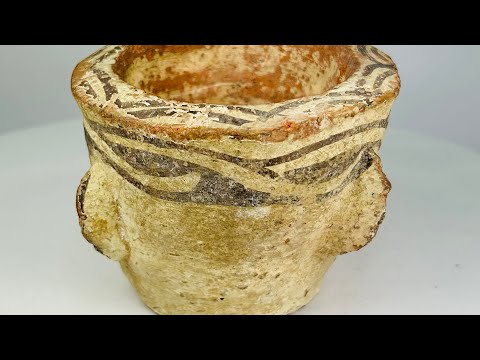 Islamic Era Afghan decorated pottery mortar, circa 12th century AD, with painted geometric designs and weathered earthen surface.