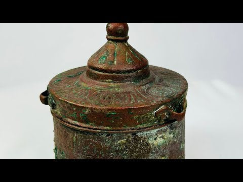 Large Islamic Khorassan bronze inkwell, 10th–12th century, with domed lid and intricate engraved motifs, aged patina and verdigris surface.