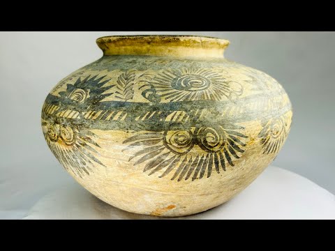 Prehistoric European terracotta jar with bulbous body, narrow neck, and hand-painted spiral, floral, and geometric motifs, circa 5500–4500 BCE, attributed to the Linear Pottery or Vinca culture.