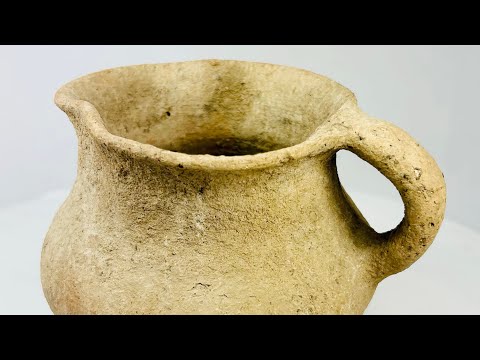 Ancient Greco-Roman terracotta pitcher, 1st–3rd century CE, with single rounded handle, wide mouth, and aged earthen surface.