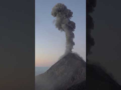 Video clip showing an erupting volcano, symbolizing the volcanic origins and cultural context of the Polynesian stone ancestor effigy.