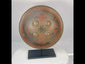 Small circular Indo-Persian Dhal shield, 11 inches diameter, lacquered black and red with damascened foliate motifs, four raised bosses, interior grips with knuckle-guard cushion, well-preserved antique.