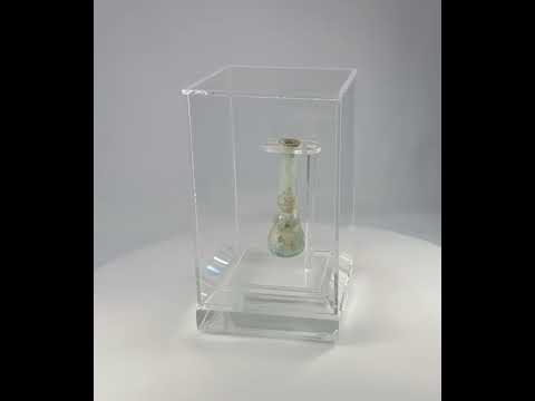 360-degree view of an ancient Roman turquoise glass balsamarium from the 2nd–3rd century AD, showing shimmering iridescence and hand-blown craftsmanship.