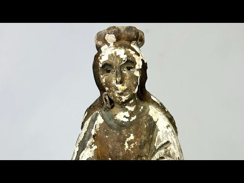 Antique Spanish Colonial Santo statue, hand-carved from wood with remnants of polychrome paint, depicting a robed religious figure with folded hands, traditional hairstyle, and worn surface patina, dating to the 18th–19th century, used for devotional practices in colonial-era Catholic households.
