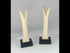360° rotating view of early 20th-century Egyptian carved candlestick holders with lotus and papyrus motifs.