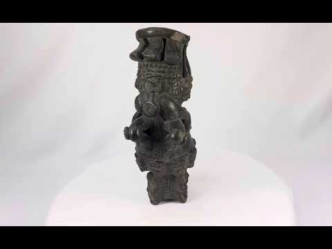 Vintage Chupícuaro-style ceramic figure from West Mexico, depicting a stylized seated form with intricate geometric motifs and applied details. Handcrafted revival piece inspired by pre-Columbian tradition, with dark burnished finish and patina.