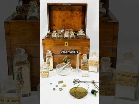 Video showcasing an antique Victorian apothecary box being unboxed, featuring 1800s medical tools, glass bottles, balance scales, and chemist’s instruments.