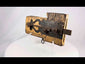Video view of an 18th-century colonial wooden door lock featuring hand-forged iron latch and original hardware