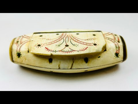 Antique Napoleonic prisoner-of-war snuff box, carved bone with red and green ink floral designs, domed lid, circa 1793–1815.