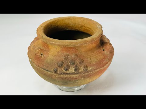 360-degree view of a Pre-Columbian terracotta vessel with raised decorative motifs, Central or South America, circa 800–1500 CE