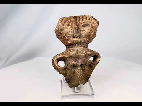 Ancient Pre-Columbian West Mexican terracotta figurine fragment, dating circa 300 BCE–300 CE, depicting a stylized human figure with incised facial features, hollow body form, and traces of red pigment; culturally significant artifact from early shaft tomb traditions, showing archaeological wear and breakage consistent with great age.