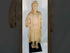 Antique Spanish Colonial wooden Santo statue depicting a standing saint with detailed robes and facial features, mounted on a black display base, 18th–19th century.