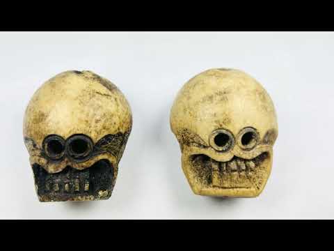 Video showcase of Tibetan Kapala Citipati ritual skull beads carved from human femur bone, highlighting front facial details and aged patina.