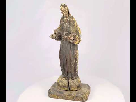 Antique Spanish Colonial wooden devotional statue, circa 18th–19th century, hand-carved with open hands in blessing pose, mounted on pedestal, with remnants of original gilt and polychrome paint, patina, and wear from centuries of use.