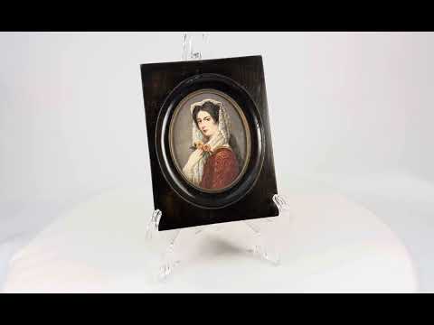 Miniature 19th-century portrait painting of a young woman in red embroidered attire with a lace mantilla, holding two yellow roses, signed “Kimsky,” framed in oval ebonized wood with brass bezel.