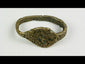 Ancient Sassanian bronze ring with engraved bezel depicting a lion and antelope predator-prey motif, symbolizing strength and balance, with rich green patina.