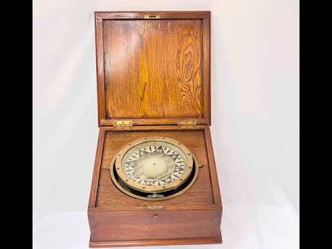 Antique brass ship compass by E.S. Ritchie, mounted in a fitted wooden case, originating from a Canadian political estate; nautical navigation instrument with original glass face, engraved directional markers, and aged patina, representing 19th–20th century maritime craftsmanship and provenance-linked historical significance.