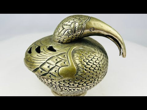 Antique South Indian Hindu ritual censer cast in bronze, crafted in the form of a stylized peacock with detailed plumage and long curved beak. Traditionally used in temple and household ceremonies for incense offerings, with natural aged patina.