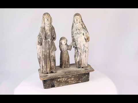 Antique Spanish Colonial Santo sculpture of the Holy Family, 19th century, hand-carved and painted wood figures depicting Joseph, Mary, and Child on a wooden base with aged patina.